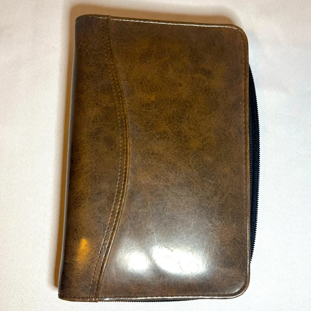 Day Timer Brown Folder With Some Papers